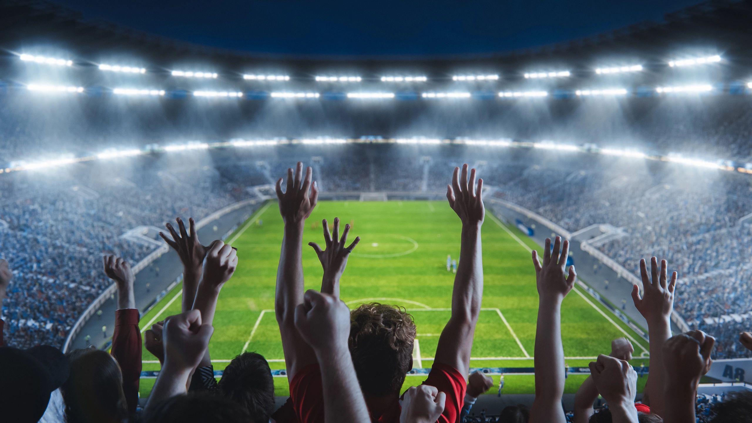 Afición en estadio durante un partido de futbol